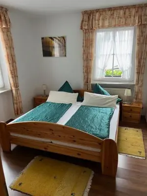 Ein Bett oder Betten in einem Zimmer der Unterkunft Gästehaus Elisabeth Bach