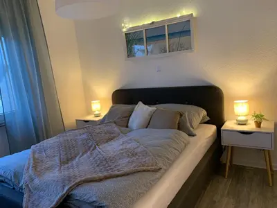 Ein Bett oder Betten in einem Zimmer der Unterkunft Ferienwohnung am Lahnpark
