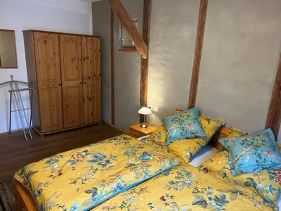 Ein Bett oder Betten in einem Zimmer der Unterkunft Ferienhaus Ausonius