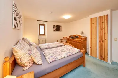 Ein Bett oder Betten in einem Zimmer der Unterkunft Ferienwohnungen Villa Mosella