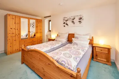 Ein Bett oder Betten in einem Zimmer der Unterkunft Ferienwohnungen Villa Mosella