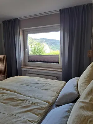 Ein Bett oder Betten in einem Zimmer der Unterkunft Ferienwohnung Wandereck