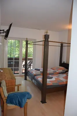Ein Bett oder Betten in einem Zimmer der Unterkunft Bergmühle Simmertal