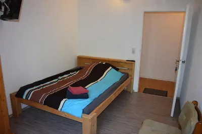 Ein Bett oder Betten in einem Zimmer der Unterkunft Bergmühle Simmertal