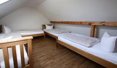 Ein Bett oder Betten in einem Zimmer der Unterkunft Gasthaus Pension Geimer