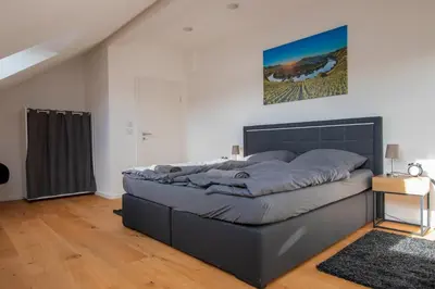 Ein Bett oder Betten in einem Zimmer der Unterkunft FeWo Wohlleben Petrus VI