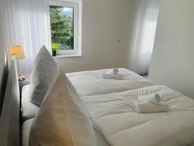 Ein Bett oder Betten in einem Zimmer der Unterkunft Koblenzer Naturhaus & Apartments