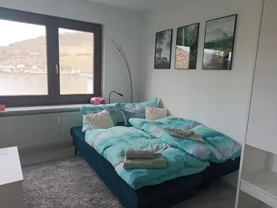 Ein Bett oder Betten in einem Zimmer der Unterkunft Apartment mit Rheinblick