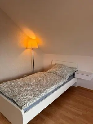 Ein Bett oder Betten in einem Zimmer der Unterkunft Familien Ferienhaus im Grünen in direkter Nähe zum Nürburgring
