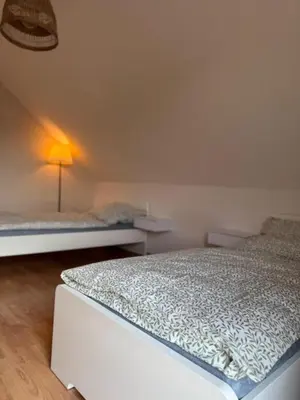Ein Bett oder Betten in einem Zimmer der Unterkunft Familien Ferienhaus im Grünen in direkter Nähe zum Nürburgring