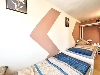 Ein Bett oder Betten in einem Zimmer der Unterkunft Apartment Ferienwohnung Renata 1 nahe Nürburgring by Interhome