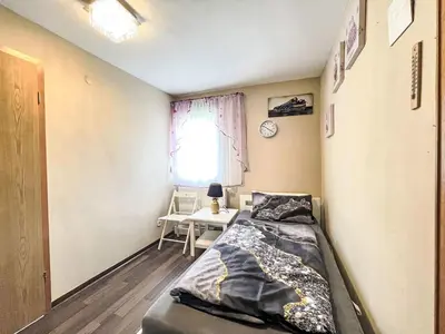 Ein Bett oder Betten in einem Zimmer der Unterkunft Apartment Ferienwohnung Renata 1 nahe Nürburgring by Interhome