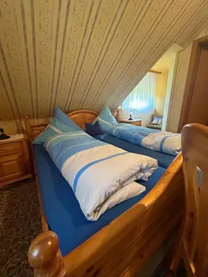 Ein Bett oder Betten in einem Zimmer der Unterkunft Gasthaus Zur Krone