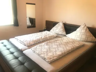 Ein Bett oder Betten in einem Zimmer der Unterkunft Haus Lowe Ferienwohnungen