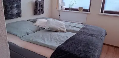 Ein Bett oder Betten in einem Zimmer der Unterkunft Die 2 Schwestern
