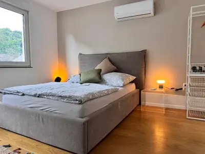 Ein Bett oder Betten in einem Zimmer der Unterkunft Weinblick am Rhein