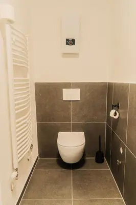 Ein Badezimmer in der Unterkunft Moderne 3-Schlafzimmer-Apartments mit Balkon & Aufzug bis 6 Personen