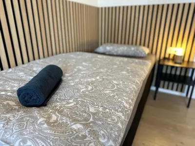 Ein Bett oder Betten in einem Zimmer der Unterkunft Kirchberg Apartments