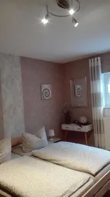 Ein Bett oder Betten in einem Zimmer der Unterkunft Ferienwohnung Schmitz
