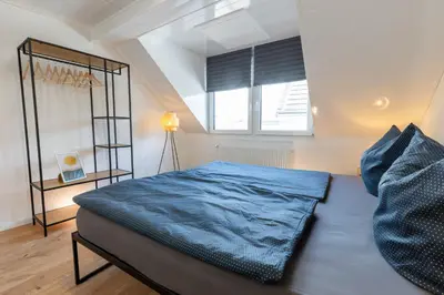 Ein Bett oder Betten in einem Zimmer der Unterkunft Vulkaneifel Cottage