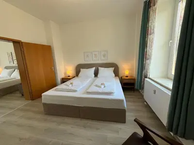 Ein Bett oder Betten in einem Zimmer der Unterkunft Sonnenschein-Apartment