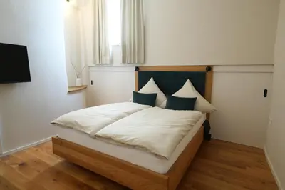 Ein Bett oder Betten in einem Zimmer der Unterkunft Charmantes Chateau Lichter - Alte Schmiede