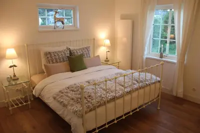 Ein Bett oder Betten in einem Zimmer der Unterkunft Rosenhill B&B