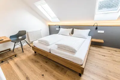 Ein Bett oder Betten in einem Zimmer der Unterkunft BG Living & Hosting - Historisches Ferienhaus 