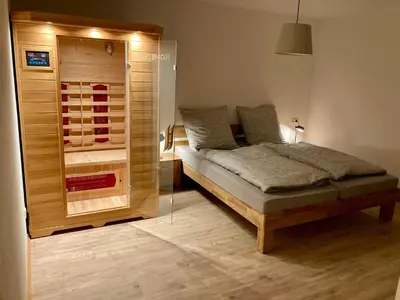 Ein Bett oder Betten in einem Zimmer der Unterkunft Ferienwohnung Pützbachtal