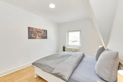 Ein Bett oder Betten in einem Zimmer der Unterkunft Gestade Fewo 4