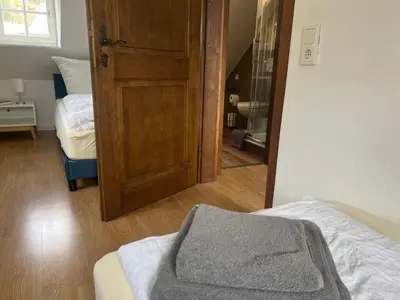 Ein Bett oder Betten in einem Zimmer der Unterkunft NringRooms am Markt