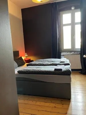 Ein Bett oder Betten in einem Zimmer der Unterkunft Vis-a-vis Apartments