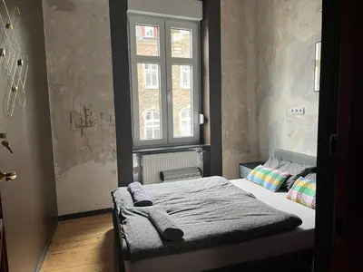 Ein Bett oder Betten in einem Zimmer der Unterkunft Vis-a-vis Apartments