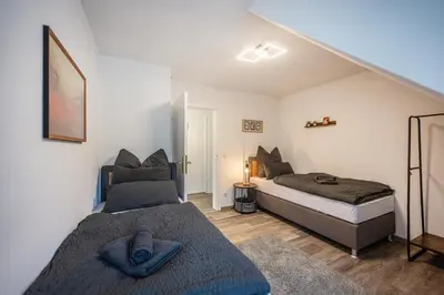 Ein Bett oder Betten in einem Zimmer der Unterkunft Obere Rheinblick-Oase Komfort mit 2 SZ Balkon