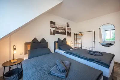 Ein Bett oder Betten in einem Zimmer der Unterkunft Obere Rheinblick-Oase Komfort mit 2 SZ Balkon