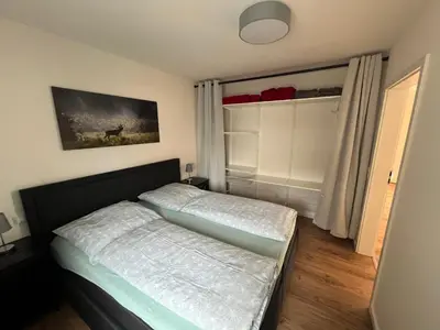 Ein Bett oder Betten in einem Zimmer der Unterkunft Al Backstuff