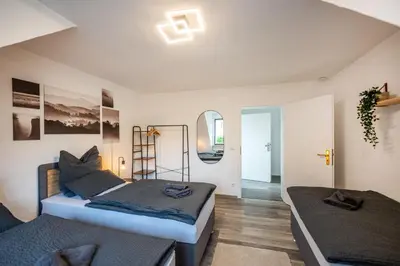 Ein Bett oder Betten in einem Zimmer der Unterkunft Rhein-View-Oase für große Gruppen - Parkplätze