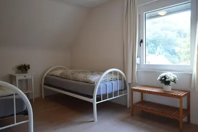 Ein Bett oder Betten in einem Zimmer der Unterkunft Veldenzer Hammer