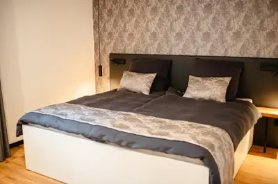 Ein Bett oder Betten in einem Zimmer der Unterkunft Naach Mattes