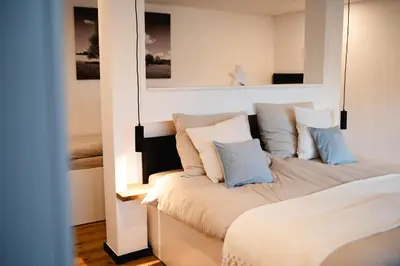 Ein Bett oder Betten in einem Zimmer der Unterkunft Naach Mattes