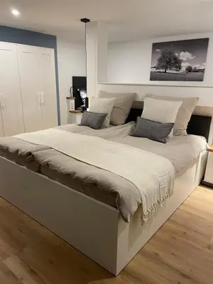 Ein Bett oder Betten in einem Zimmer der Unterkunft Naach Mattes