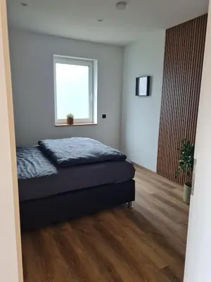 Ein Bett oder Betten in einem Zimmer der Unterkunft Ferienhaus Alex
