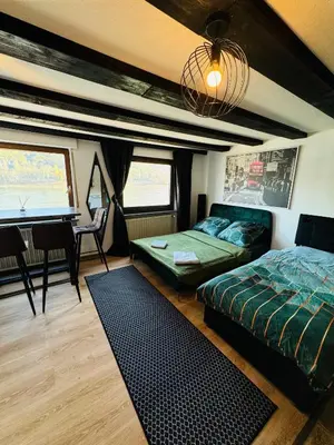 Ein Bett oder Betten in einem Zimmer der Unterkunft Loft Fluss Blick