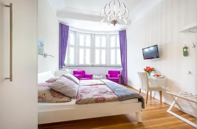 Ein Bett oder Betten in einem Zimmer der Unterkunft Gästehaus & Weingut Clüsserath-Weiler