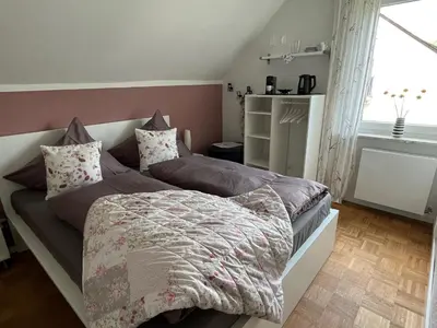 Ein Bett oder Betten in einem Zimmer der Unterkunft Gästehaus Schorn