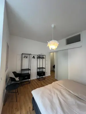 Ein Bett oder Betten in einem Zimmer der Unterkunft Ferienwohnung Äskulaphof