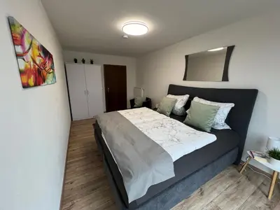 Ein Bett oder Betten in einem Zimmer der Unterkunft Ferienwohnung Goldrausch