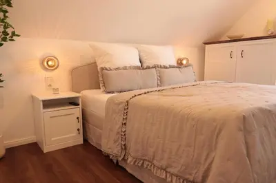 Ein Bett oder Betten in einem Zimmer der Unterkunft Ferienhaus Unter der Burg