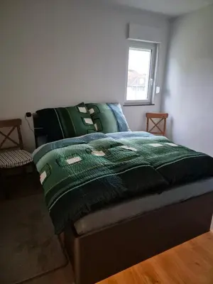 Ein Bett oder Betten in einem Zimmer der Unterkunft Guesthouse Wallenborn - Appartement