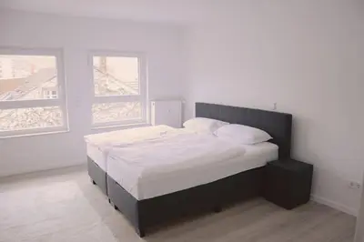 Ein Bett oder Betten in einem Zimmer der Unterkunft RheinBlick